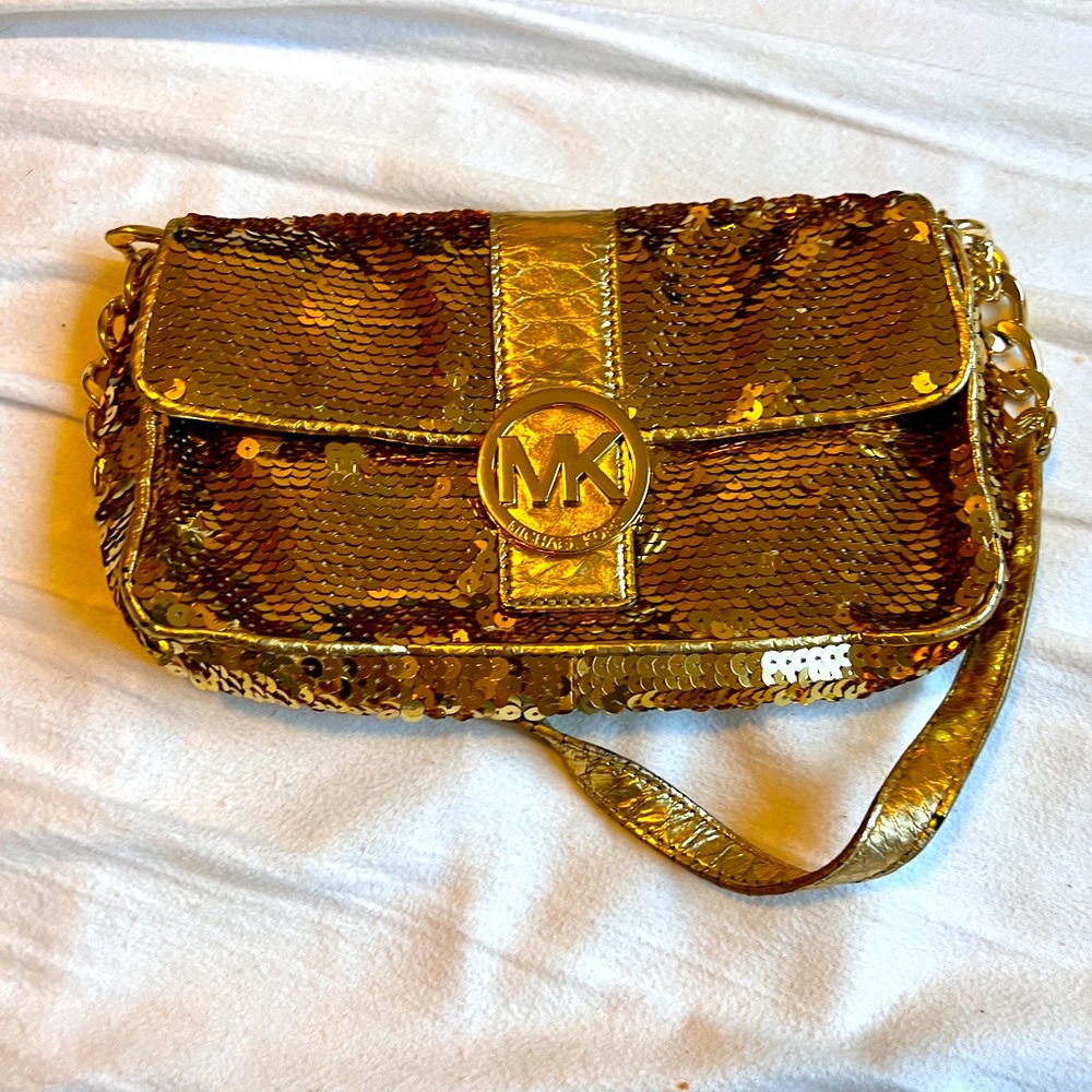 MK sparkling gold clutch.